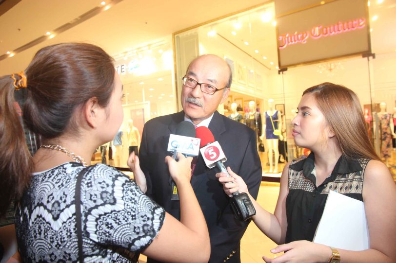 (center) Japan Amb H.E. Toshinao Urabe was interviewed from left by GMA News’ Cata Inocencio and TV5 Aksyon Anne Cabral. Photo was taken at the Shang East Wing where the opening of Eiga Sai fest was held. The Eiga Sai Japanese Film Festival will screen films for free run from July 4 to 13, 2014 at the Shang Cineplex, Shang Rila Plaza Mall. Photo by Jude Bautista